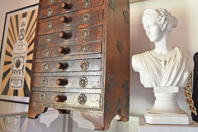detail view of a jewelry box and bust statuette in a dressing room designed by Brand*Eye Home