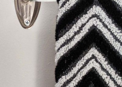 detail of a towel rack in a dressing room designed by Brand*Eye Home
