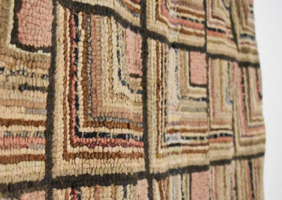 detail of a quilt hanging on a wall in a guest and craft room designed by Brand*Eye Home