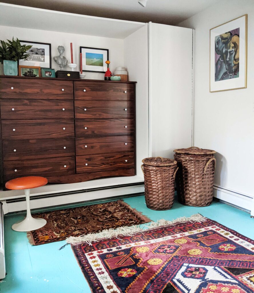 A bedroom with a mixture of vintage and modern pieces. 